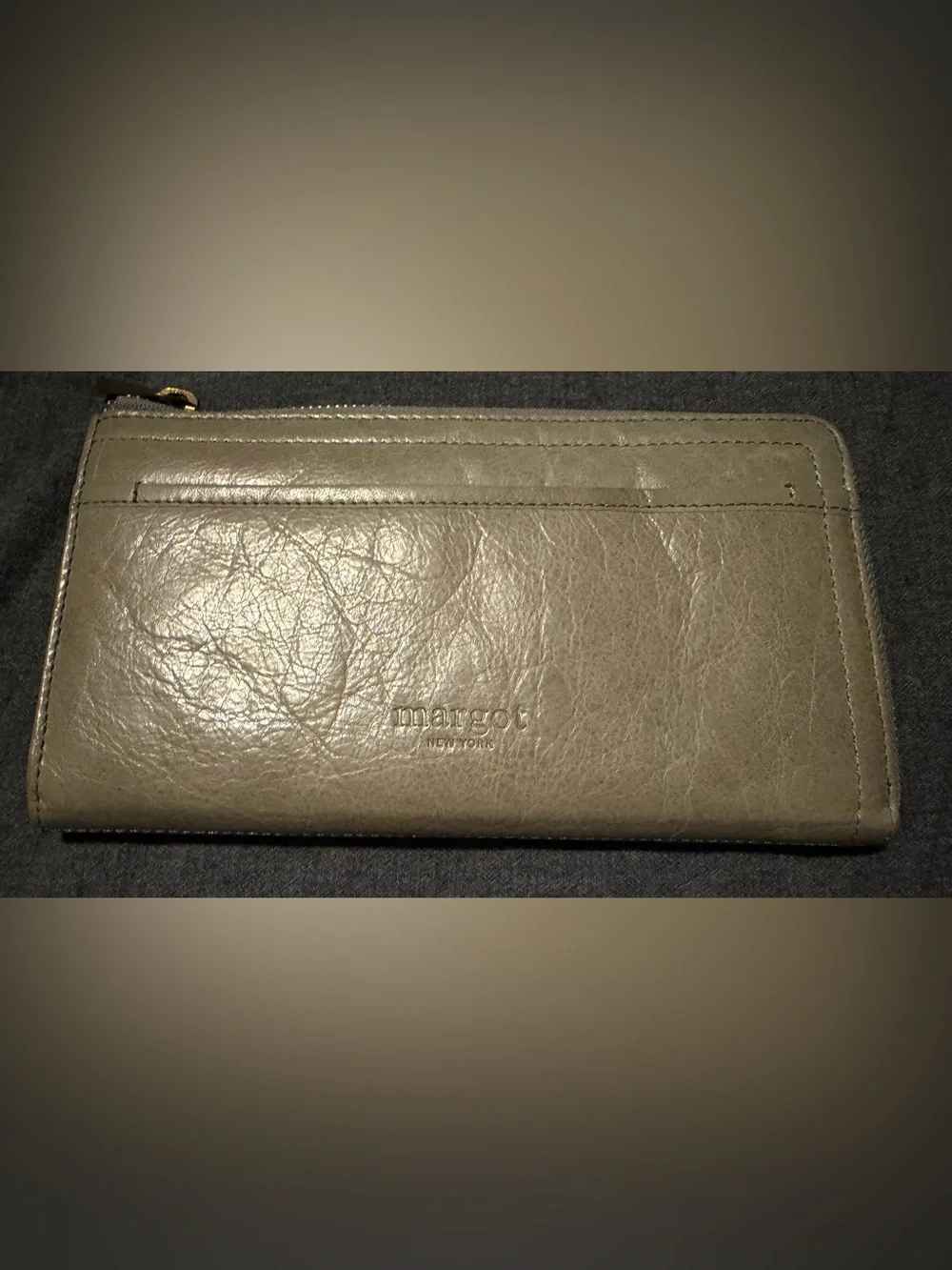 Margot “Gabby” zip around wallet in grey/beige with light blue accents.